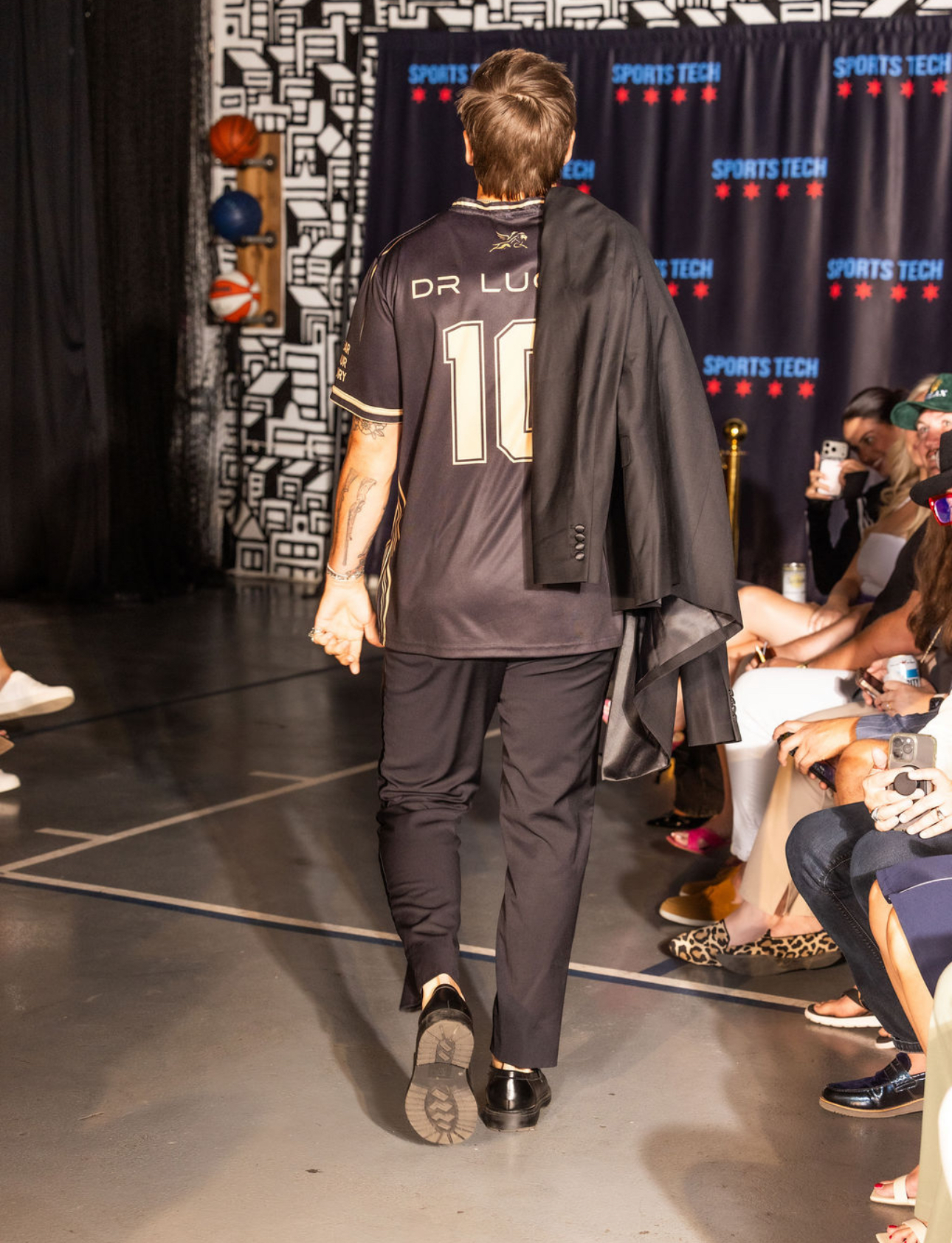 A Dr. Lucas edition look walking away down the runway